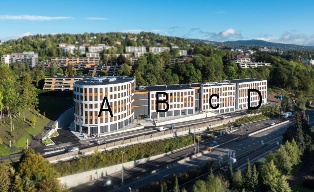 Picture of Silurveien with big letters on to mark the different buildings. From left to right: A, B, C, D.
