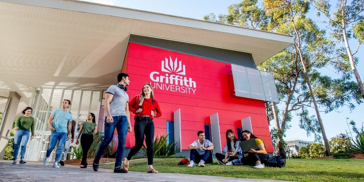 Students at the entrance to the Chancellery Building, Griffith University